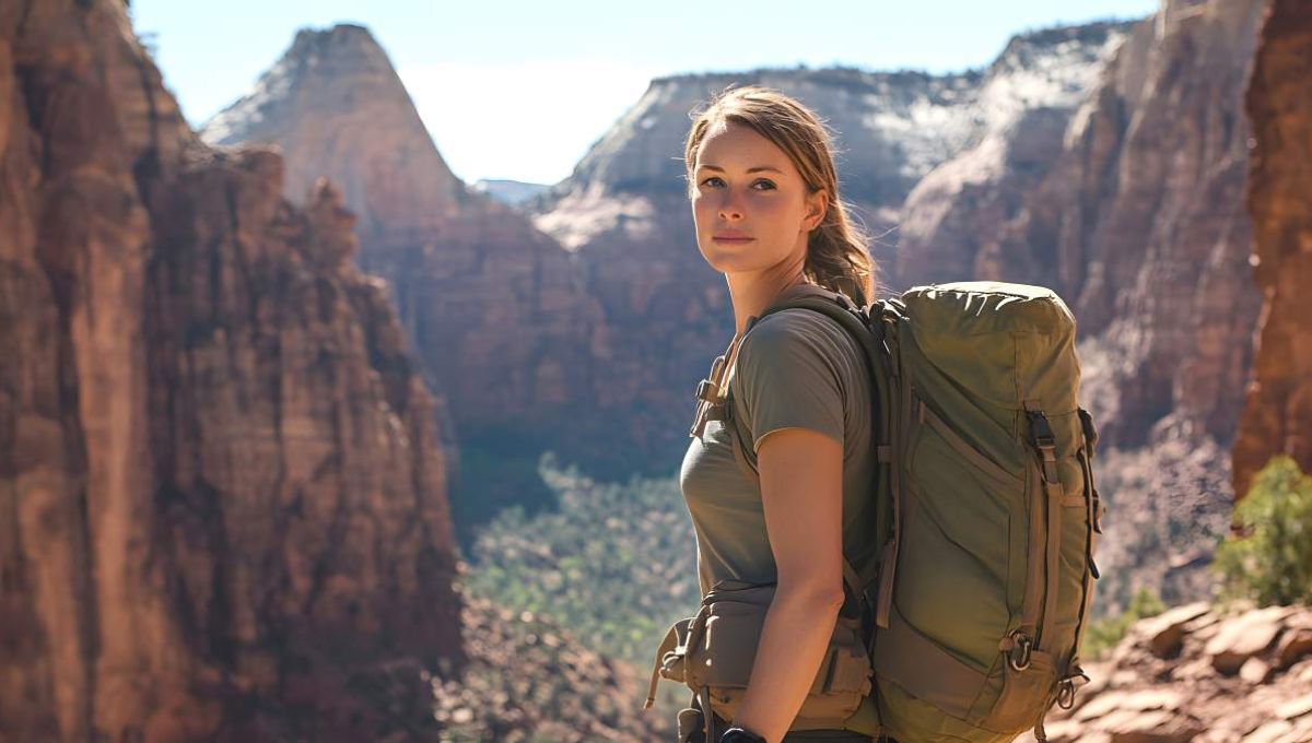 Femme avec un sac à dos dans un paysage montagneux - crédit photo : Farid via Adobe Stock